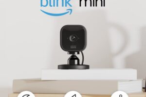 Produktbild von Blink Mini | Compact indoor plug-in smart security camera, 1080p HD day and night video, night vision, motion detection, two-way audio, easy setup, Works with Alexa — 2 cameras (Black)